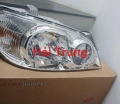 0K53A51030 Đèn pha Kia Carnival 2005-2009