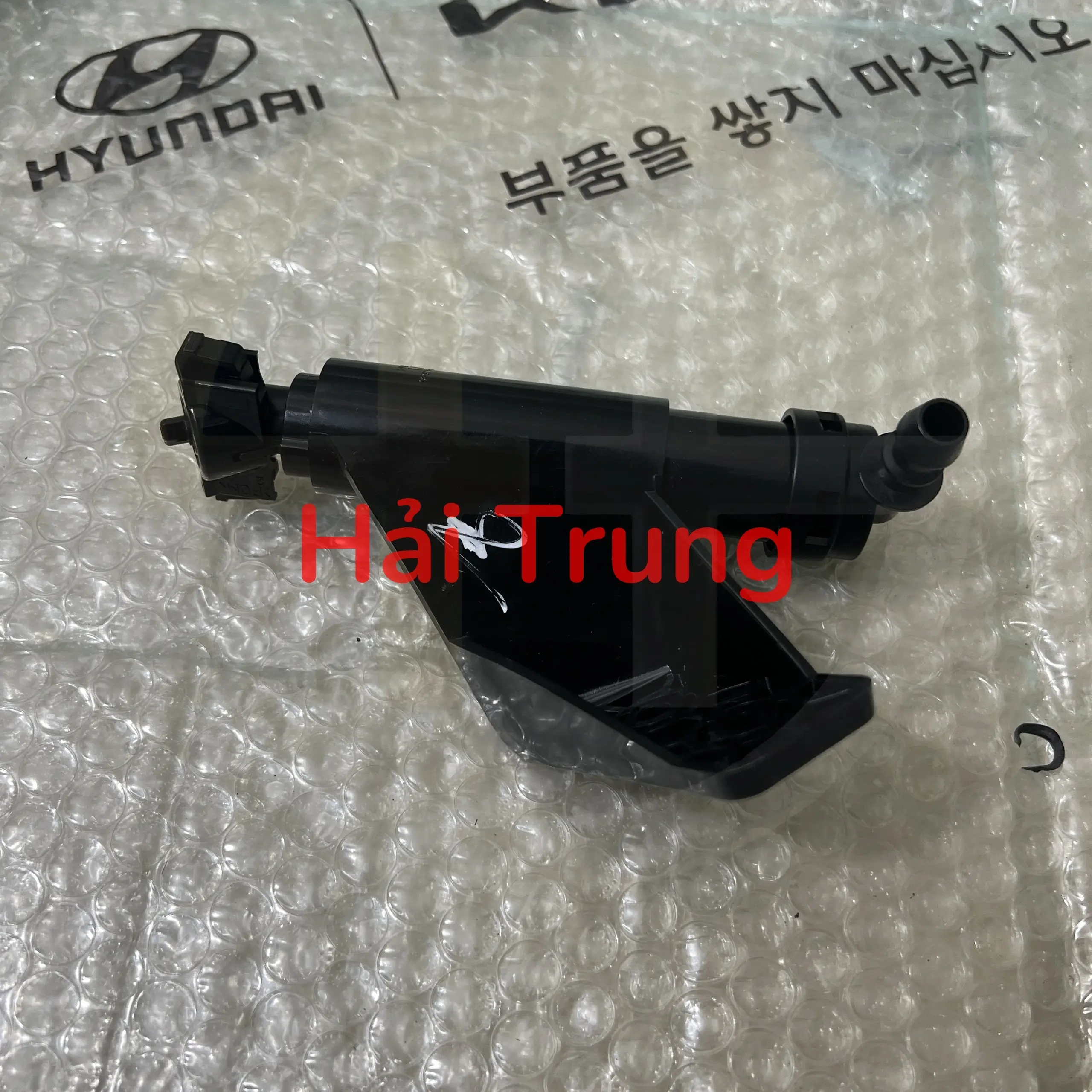 Vòi phun nước rửa pha trái huyndai Santafe 2010