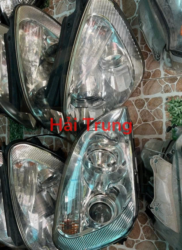 Đèn pha Kia Carens Tháo Xe