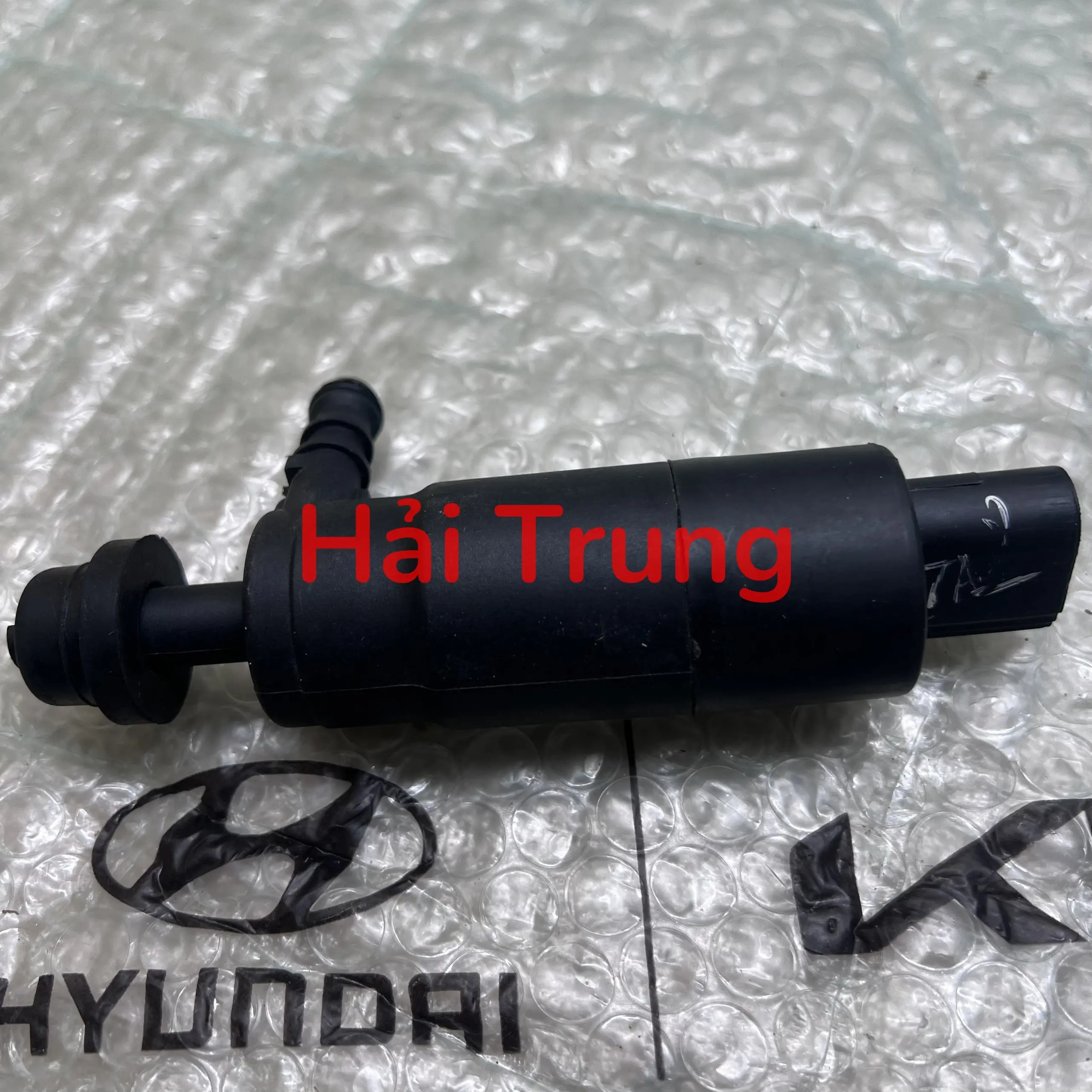 Mô tơ bơm nước rửa đèn pha Hyundai Tucson 2015-2021 chính hãng 985103F200